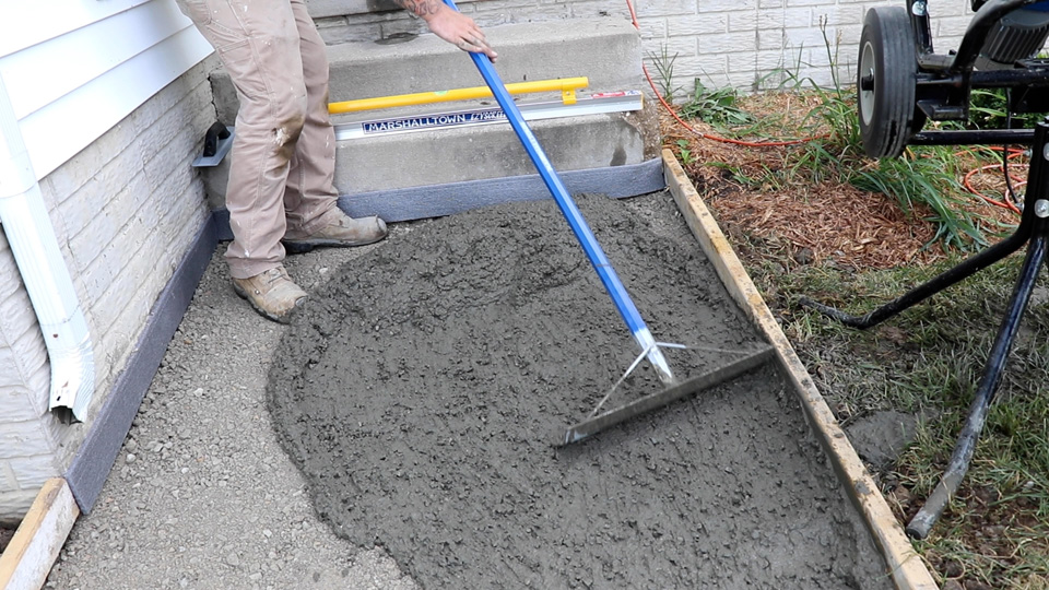 using a placer to move the concrete into place